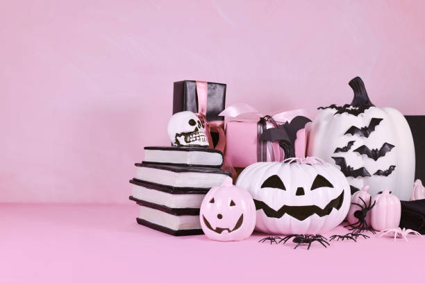 istock Modern pink Halloween decor with pink and black objects 1673873760
