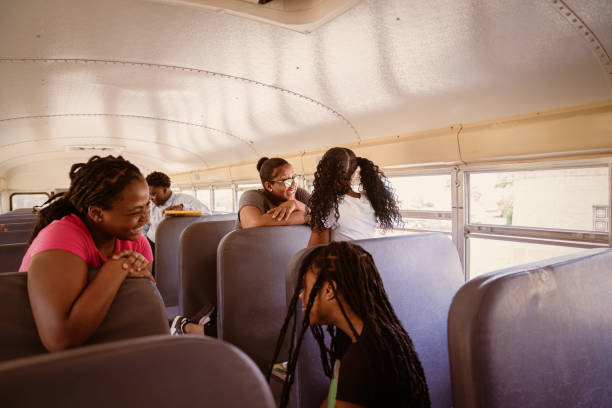 istock Junior-high Black students arrive to school via school bus. 1673889934