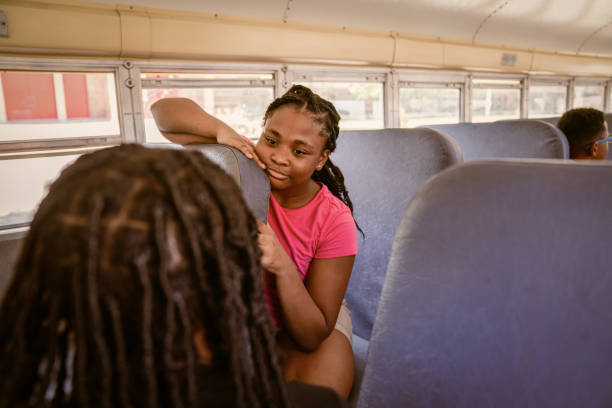 istock Junior-high Black students arrive to school via school bus. 1673890098