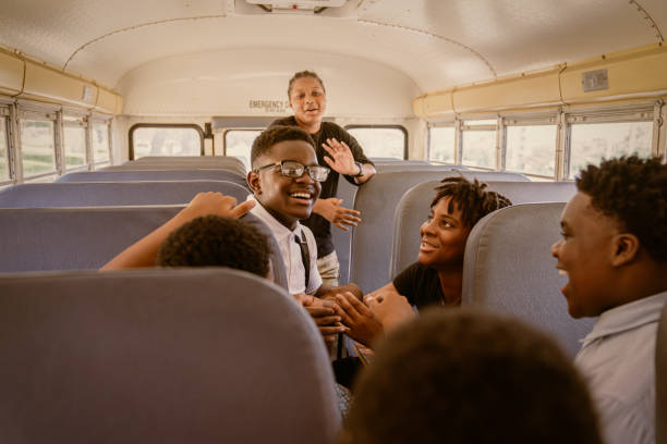 istock Junior-high Black students arrive to school via school bus. 1673890253