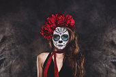 Dia De Los Muertos Sugar skull woman surrounded by smoke