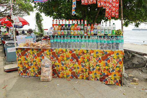 Kochi, Kerala, India-October 8 2022; A Street Juice center selling Fresh fruit refreshments and water in the promenade of Kochi beach in Kerala, India.