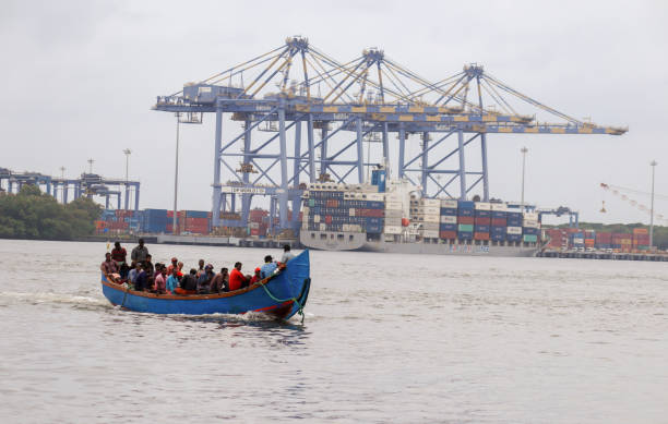 A Ferry boat carrying the daily wage lobors for work in the Shipping Dock yard at Kochi seacoast in Kerala, India. Kochi, Kerala, India-October 8 2022; A Ferry boat carrying the daily wage lobors for work in the Shipping Dock yard at Kochi seacoast in Kerala, India. cochin kerala india chinese fishing net stock pictures, royalty-free photos & images