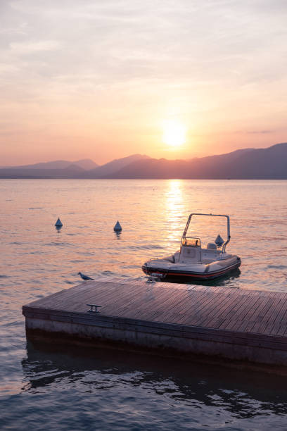 Lake Garda wharf speedboat sunset
