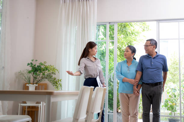 istock Happy couple elderly looking new home while agent real estate explaining and visit, real estate agent talking customer about rental housing, banking and mortgage officers, business and insurance concept. 1673911659