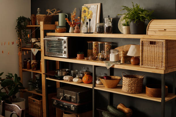 istock Wooden shelves with kitchenware, ripe vegetables and other objects 1673913260