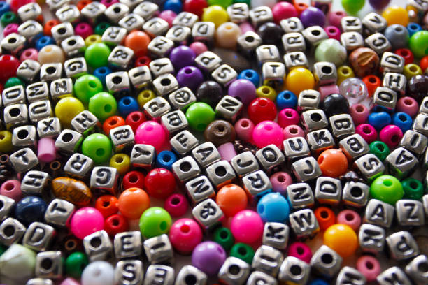 istock Background from different colored beads with numbers and symbols 1673918248