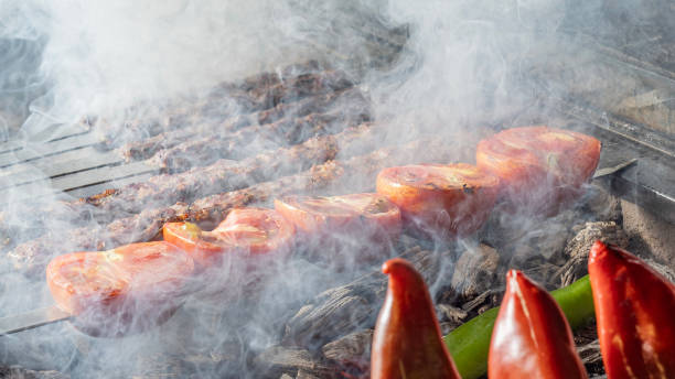 Traditional Turkish grilled shish kebab. Kebab on charcoal barbeque. Shish kebab. Kebab. Adana Kebab on Grill. stock photo