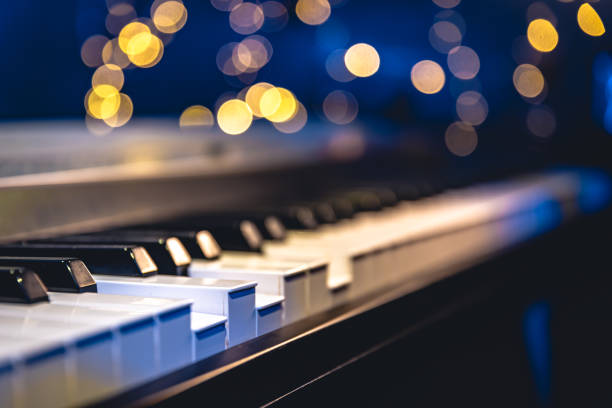 istock Piano keys close-up on a blurred background with bokeh. 1673939809