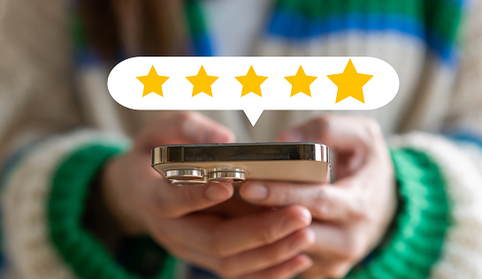 Human use phone showing give feedback icon satisfaction survey, five star, customer, satisfaction, review, feedback, top service excellent, Quality assurance 5 star, positive, customer service