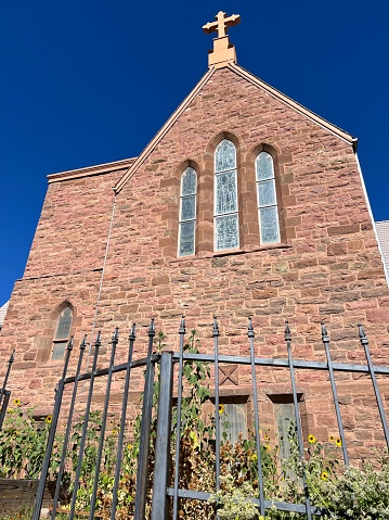 A church with an iron gate- St. Andrew’s Episcopal Church