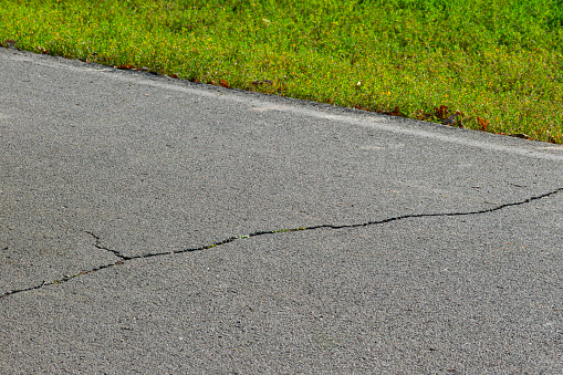 cracks in the asphalt. the concept of the need to repair the roadway. close-up