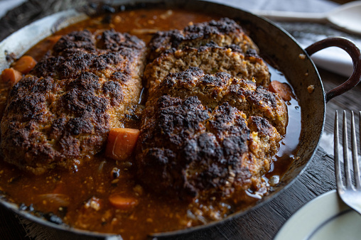 Delicious homemade meatloaf with brown gravy. Traditional german 