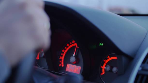 istock Car Dashboard and Female Hands Holding Steering Wheel During Driving 1673976873