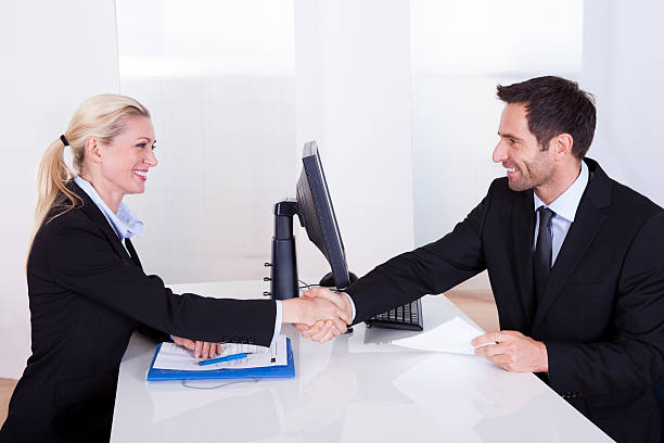 istock Business man and woman shaking hands 167397770