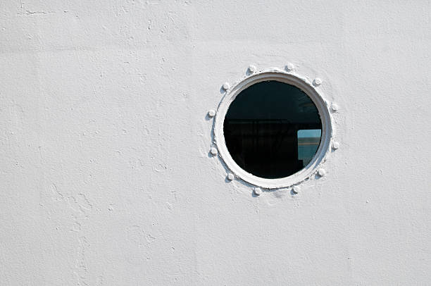 istock Painted brass porthole on the side of a ship 167397808