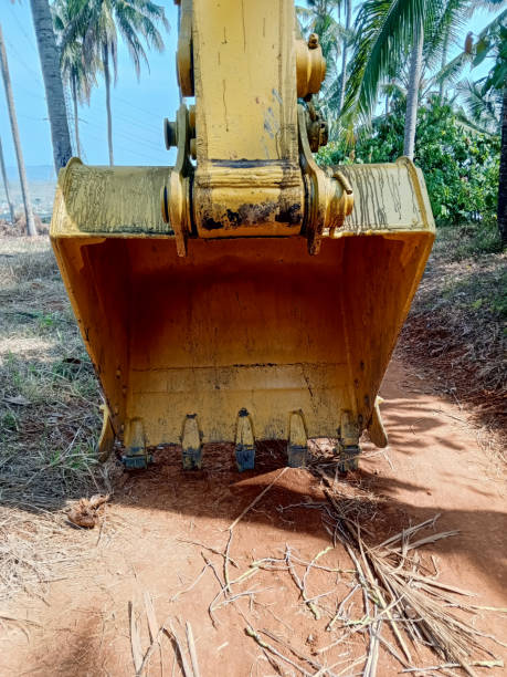 istock Close up bucket excavator dirty and old 1673984742