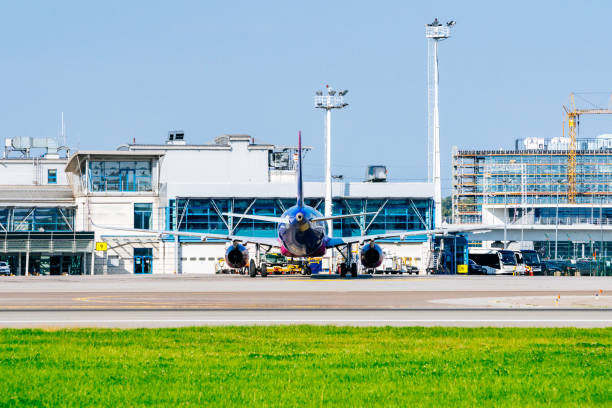 istock Large passenger airplane parked at airport terminal. 1673999200