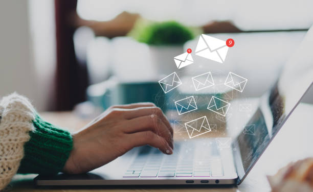 istock Human use laptop with email and surfing the internet with email icon, e-mail communication, e-mail marketing, send e-mail, news letter, data link tech, online working internet network 1674032529