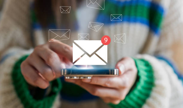 istock Human use phone with email and surfing the internet with email icon, e-mail communication, e-mail marketing concept, send e-mail or news letter, online working internet network 1674032564