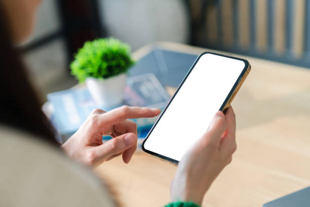 istock Human working on modern smartphone with blank white mobile screen for advertising, mockup, technology, advertising, search information, creative design, social media, online marketing, chat, phone 1674033404