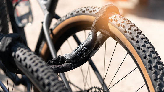 Bicycle lock chained to two bicycles