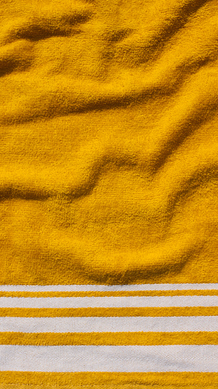 White stripes detail in yellow towel
