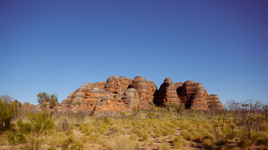 The sandstone domes of the Bungle Bungle range consist of alternating orange and grey sandstone layers.