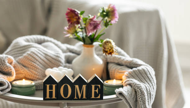 istock Composition with candles, flowers and decorative word home. 1674049690