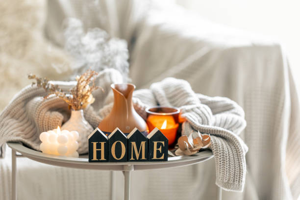 istock Aroma composition with a modern aroma oil diffuser, candles and a knitted element. 1674049692