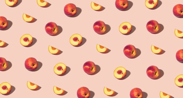istock Colorful pattern of fresh ripe whole and sliced peaches 1674066320