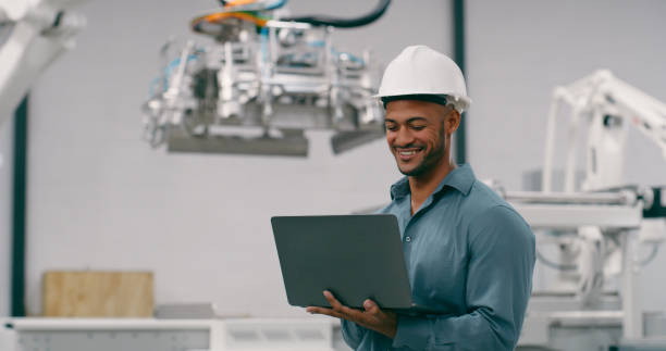 istock Engineering, man and robotics, laptop and programming of robot with machine learning and high tech. Innovation, future technology and engineer, workshop and automation with industry 4.0 and software 1674079907