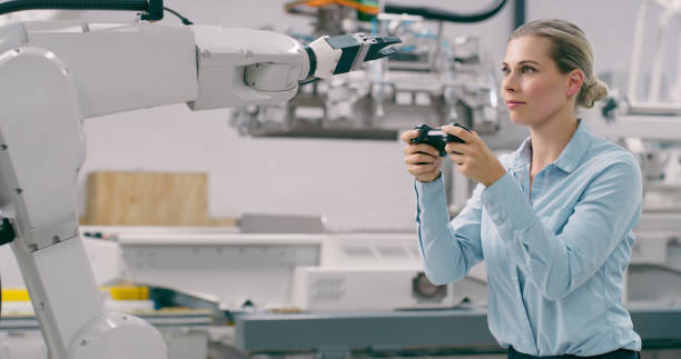 istock Woman, robotics and remote control in lab, science and engineering, futuristic development or electronics. Machine learning, scientist and tech with click, cyber automation and training with arm 1674079909