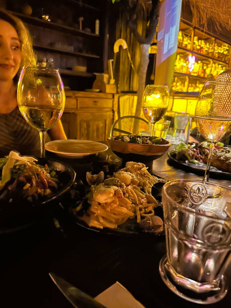 istock People are eating on vacation. night dinner table 1674080473