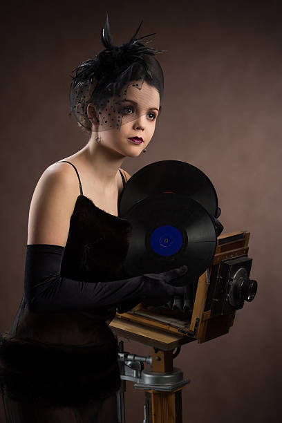 istock Young woman in retro style with vinyl plate 167409080