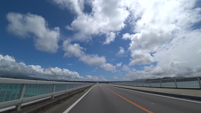 OKINAWA, JAPAN : Driving around Kouri Island bridge in sunny summer day.