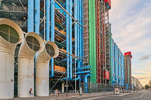Paris, France - July 11, 2023: Pedestrians and traffic on Rue Beaubourg at the Center Pompidou in the evening.