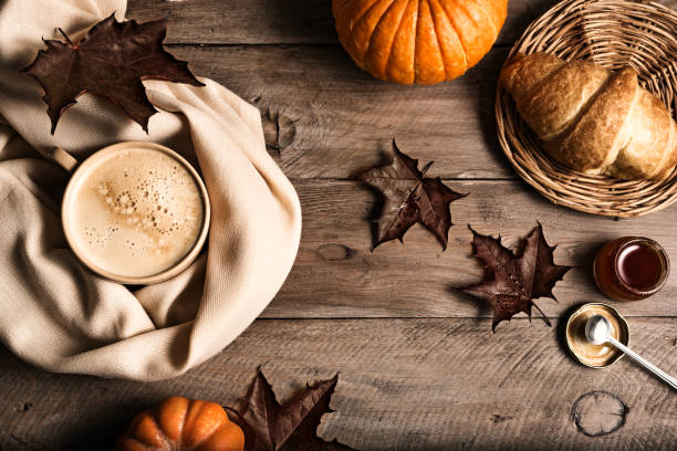 istock Autumn background with coffee and pumpkins 1674140044