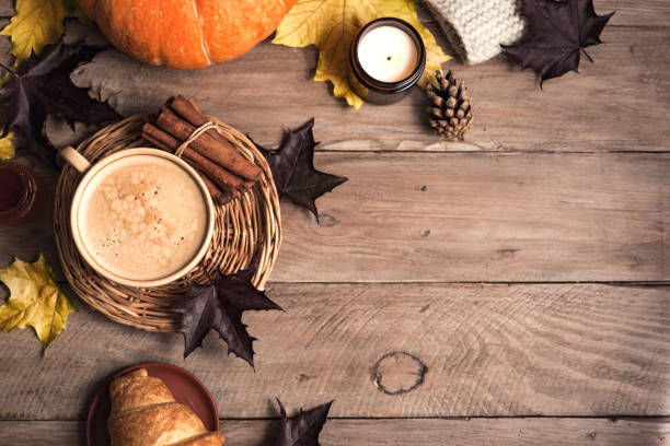 istock Autumn background - coffee, pumpkins and maple leaves 1674140122