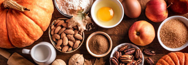 istock Autumn baking background with pumpkins, apples and nuts 1674140338