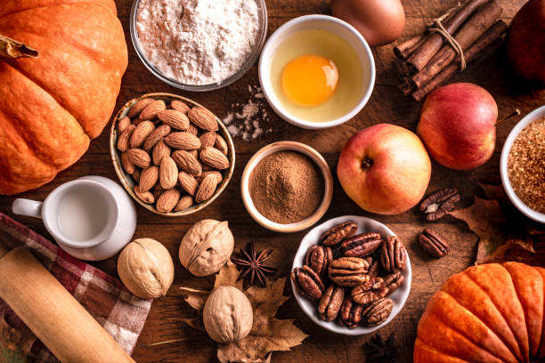istock Autumn baking background with pumpkins, apples and nuts 1674140911
