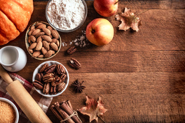 istock Autumn baking background with pumpkins, apples and nuts 1674140976