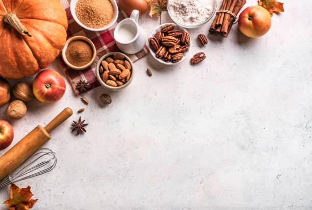 istock Autumn baking background with pumpkins, apples and nuts 1674141217