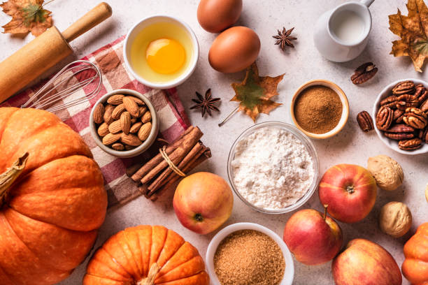 istock Autumn baking background with pumpkins, apples and nuts 1674141322