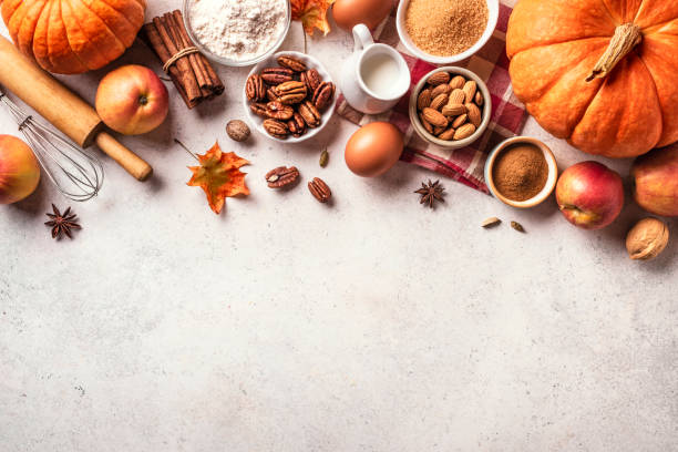 istock Autumn baking background with pumpkins, apples and nuts 1674141323