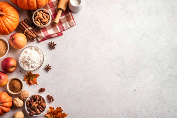 istock Autumn baking background with pumpkins, apples and nuts 1674141324