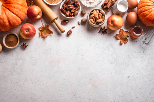 istock Autumn baking background with pumpkins, apples and nuts 1674141404