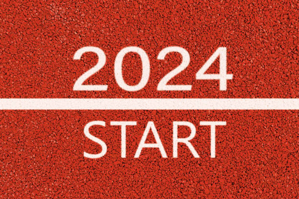 istock Step into 2024 on road and white lines on red asphalt. new year. 1674144891
