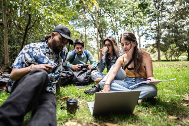 istock University friends studying together at the public park 1674163379