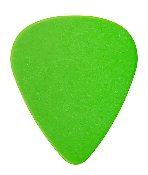 green plastic guitar plectrum, isolated on white